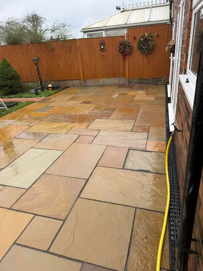 Indian sandstone patio cleaned back to colour