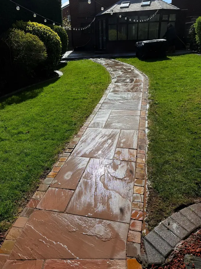 Sandstone flag path cleaned across the back garden
