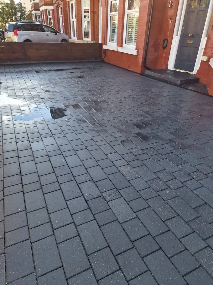 Large charcoal block paving driveway jet washed clean