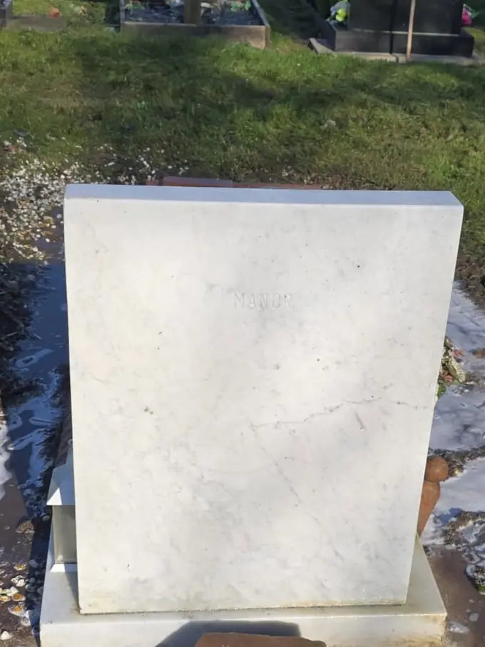 Memorial headstone cleaned back to bright stone