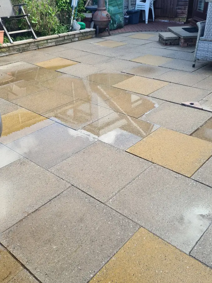 Buff sandstone patio washed back to its natural colour