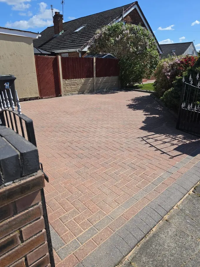 Red block paving driveway cleaned