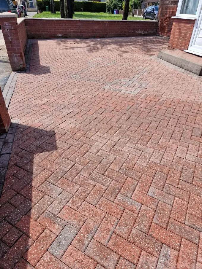 Large red block paving driveway washed clean of grime