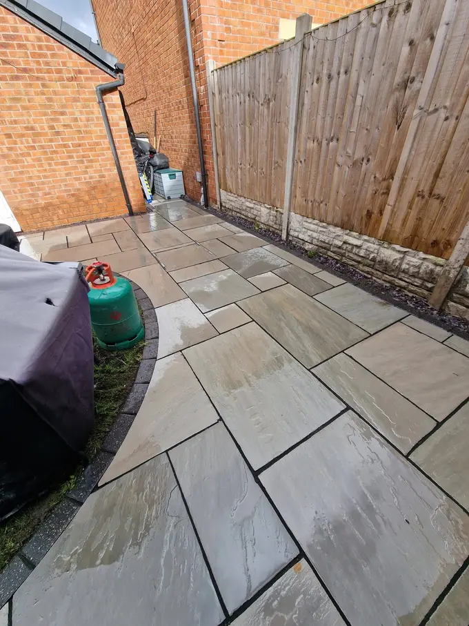 Riven grey patio flags cleaned back to their natural colour