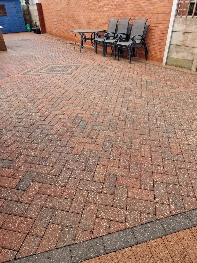 Block paved patio cleaned around the garden furniture