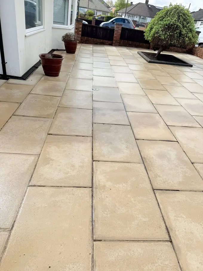 Sandstone patio cleaned back to colour by the conservatory