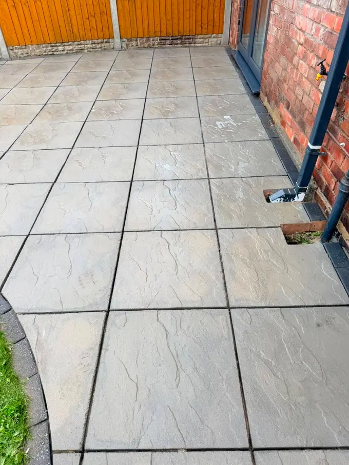 Buff sandstone patio washed back to its natural colour