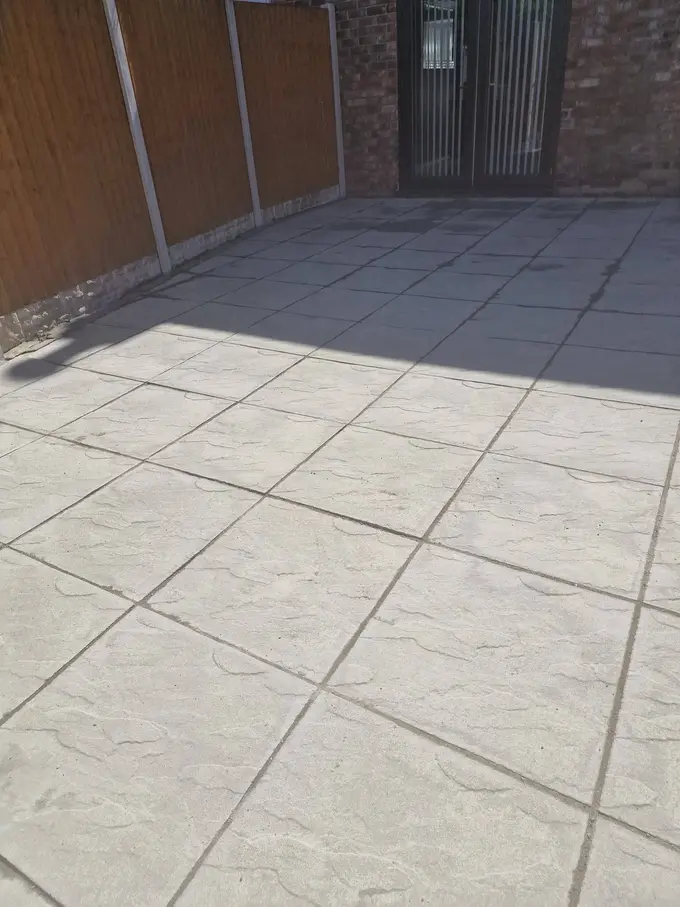 Grey flagged driveway soft washed clean